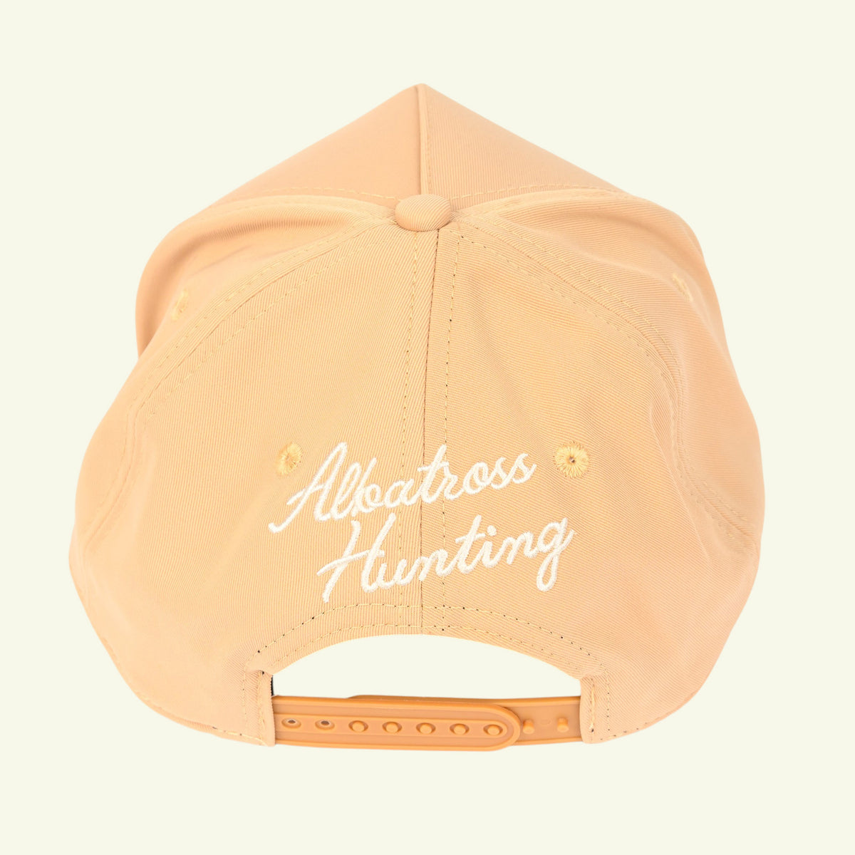 Back of tan rope cap with white Albatross Hunting script embroidery and tan snapback