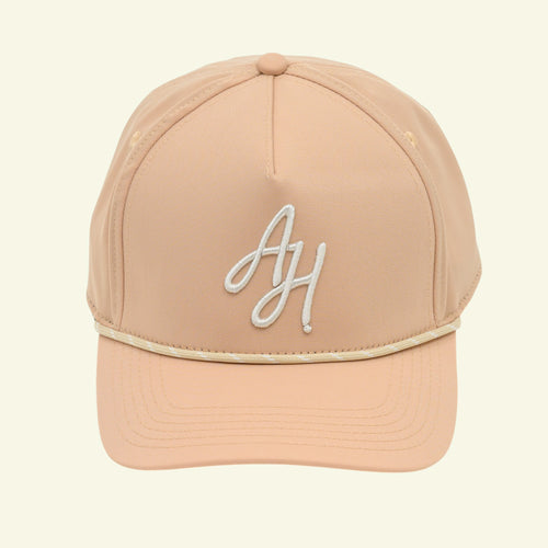 Load image 1 in gallery view. Tan Albatross Hunting A-frame rope cap, front view, white AH script monogram and cream rope